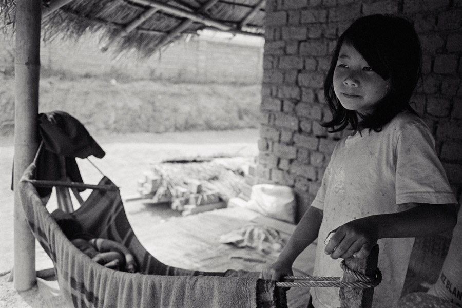 Won Mei village, Eastern Shan State 2012: a Palaung girl cares for her infant sibling.