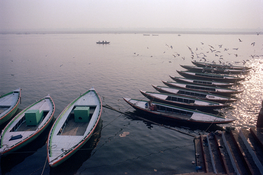 Varanasi, India 2014: Boats waiting in the early morning along the holy Ganges.