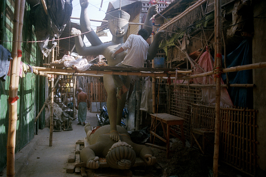Kolkata, India 2015: Kumartuli is a small, narrow-laned neighborhood where sculptors of religious idols live. Some are made with clay over a straw structure, some are made of fiberglass for greater permanence. An interesting place to observe skilled humans creating gods and goddesses.