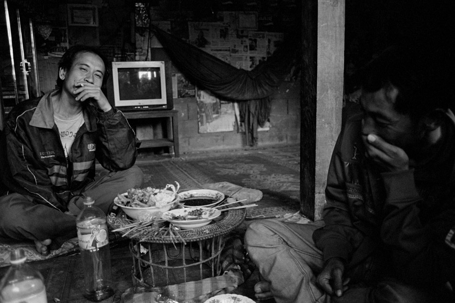 Nong Khiaw, Laos 2011: day drinking and snacking with some local dudes.